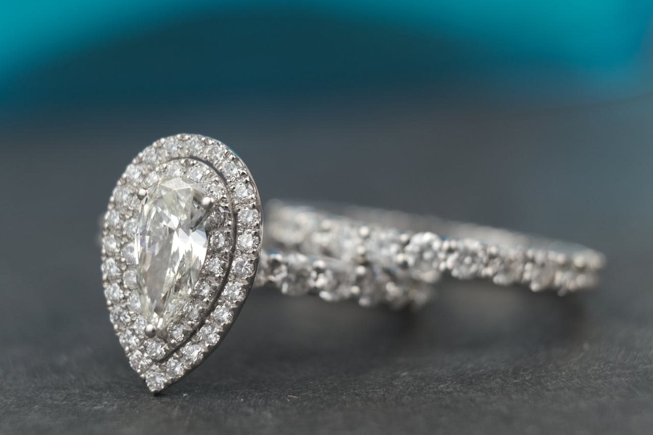 A luxurious close-up of a pear-cut diamond ring showcasing its sparkle and elegance.